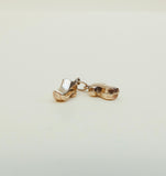 A pair of tiny 9ct gold clogs charm