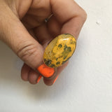 Oval bumblee jasper gemstone ring in gold and silver - in hand