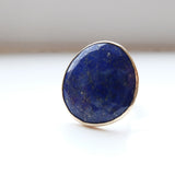 lapis lazuli gemstone ring set in gold with a sterling silver ring - front view of semi precious stone