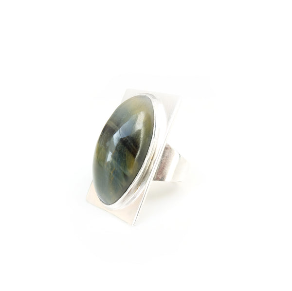 Oval tigers eye gemstone ring set in square sterling silver setting  light