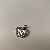 A rare 9ct gold vintage apple shaped 1978 charm.