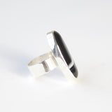 oval black banded agate gemstone ring in sterling silver - side view with silver band