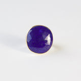 lapis lazuli gemstone ring set in gold with a silver ring - front view of earth stone