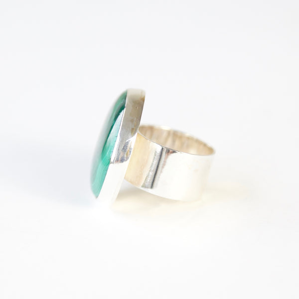 large green malachite gemstone ring - semi precious gemstone ring set in gold with a sterling silver ring - left view