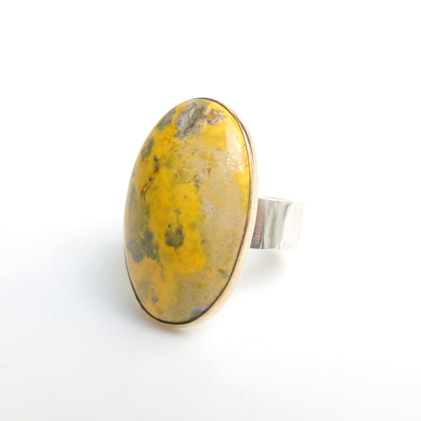 Oval bumblee jasper gemstone ring in gold and silver side view