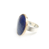 lapis lazuli gemstone ring set in gold with a sterling silver ring - left side with sterling silver ring