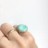 bright tibetan turquoise gemstone ring set in 9ct gold and sterling silver