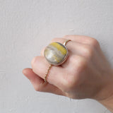 bumble bee jasper gemstone ring in stepped lipped silver setting -worn on hand